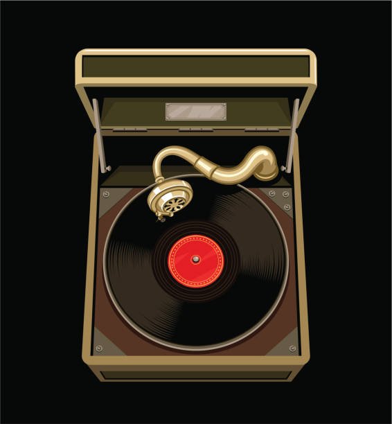 A man setting up analog sound gear with a U-Turn Orbit turntable and Klipsch speakers in a rugged wood-paneled room.