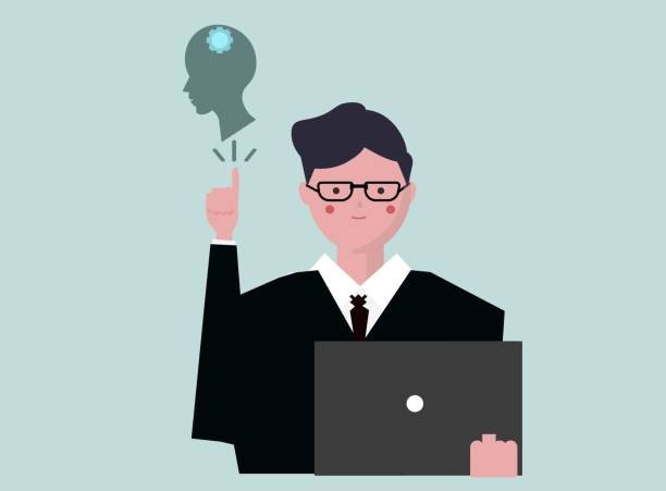 A professional in a suit with glasses raising a finger, a glowing brain silhouette above, and a laptop in front, symbolizing emotional intelligence and leadership development through online courses in 2025.