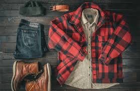 a pair of Carhartt leather gloves a Filson Mackinaw Cruiser jacket and raw denim