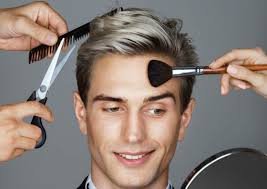 Man getting groomed with comb, scissors, and brush—representing essential grooming routines for men.