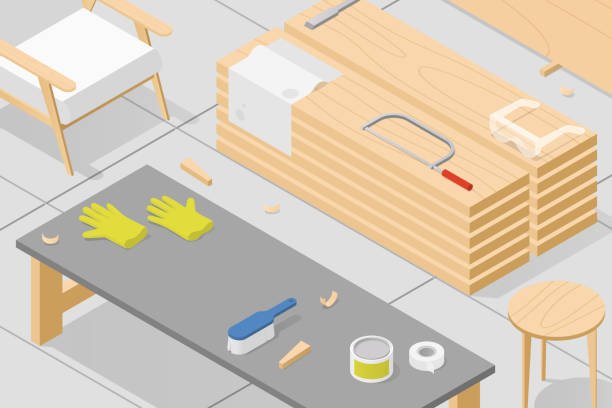 A workspace setup for building a custom workbench, featuring a table with tools including a paintbrush, paint can, gloves, and tape, alongside stacks of wooden planks, a saw, safety goggles, and a chair.