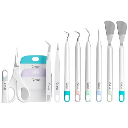 A collection of essential Cricut crafting tools, including various weeders, scrapers, scissors, and tweezers, representing a foundational toolkit for any user.